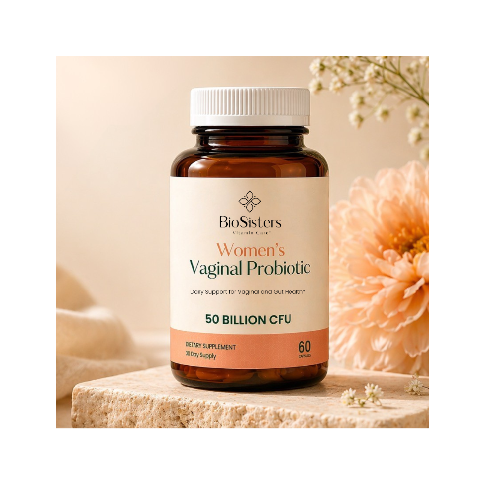 Bottle of BioSisters Women's Vaginal Probiotic on a wooden surface with flowers in the background